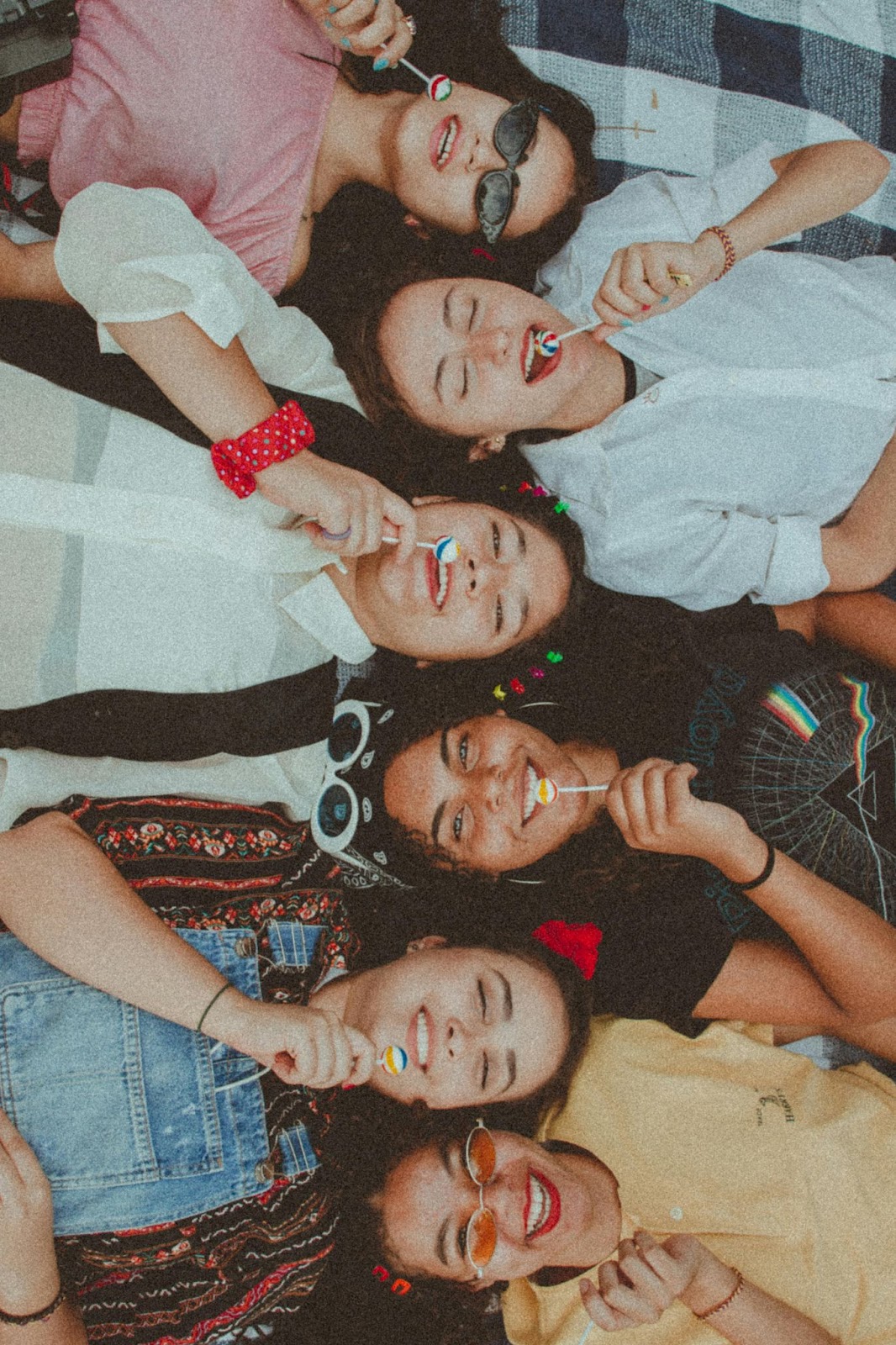 Group of People with Lollipops