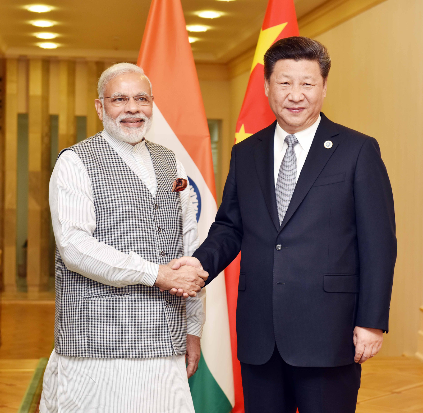 Indian Prime Minister Narendra Modi and Chinese President Xi Jinping shaking hands at a BRICS summit