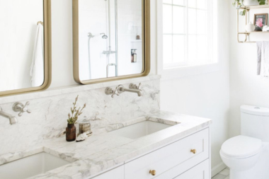 how to select the perfect countertops for your bathroom remodel marble countertop with slab backsplash and framed mirrors custom built michigan