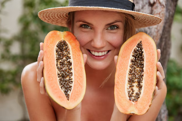 women holding papaya