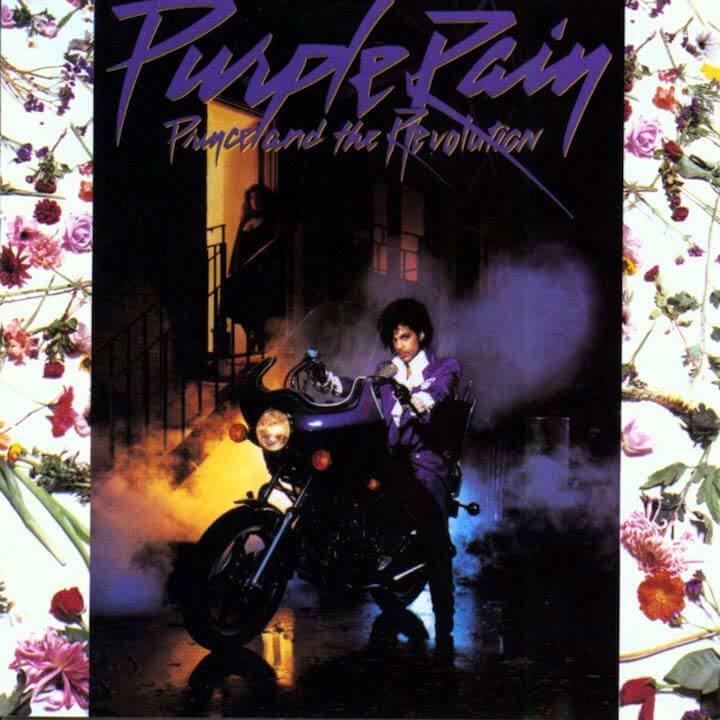 Prince's 'Purple Rain' album cover featuring the artist on a motorcycle in a purple suit, surrounded by smoke and flowers.