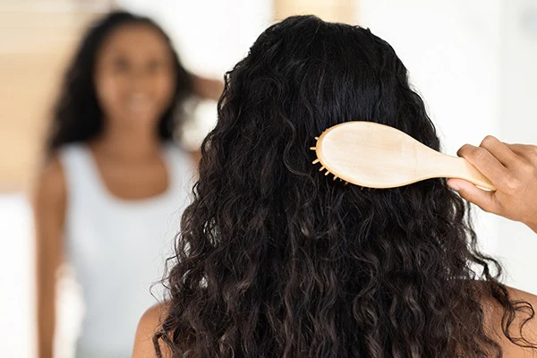 Gentle detangling is key to how to prevent split ends and reduce hair breakage while styling.