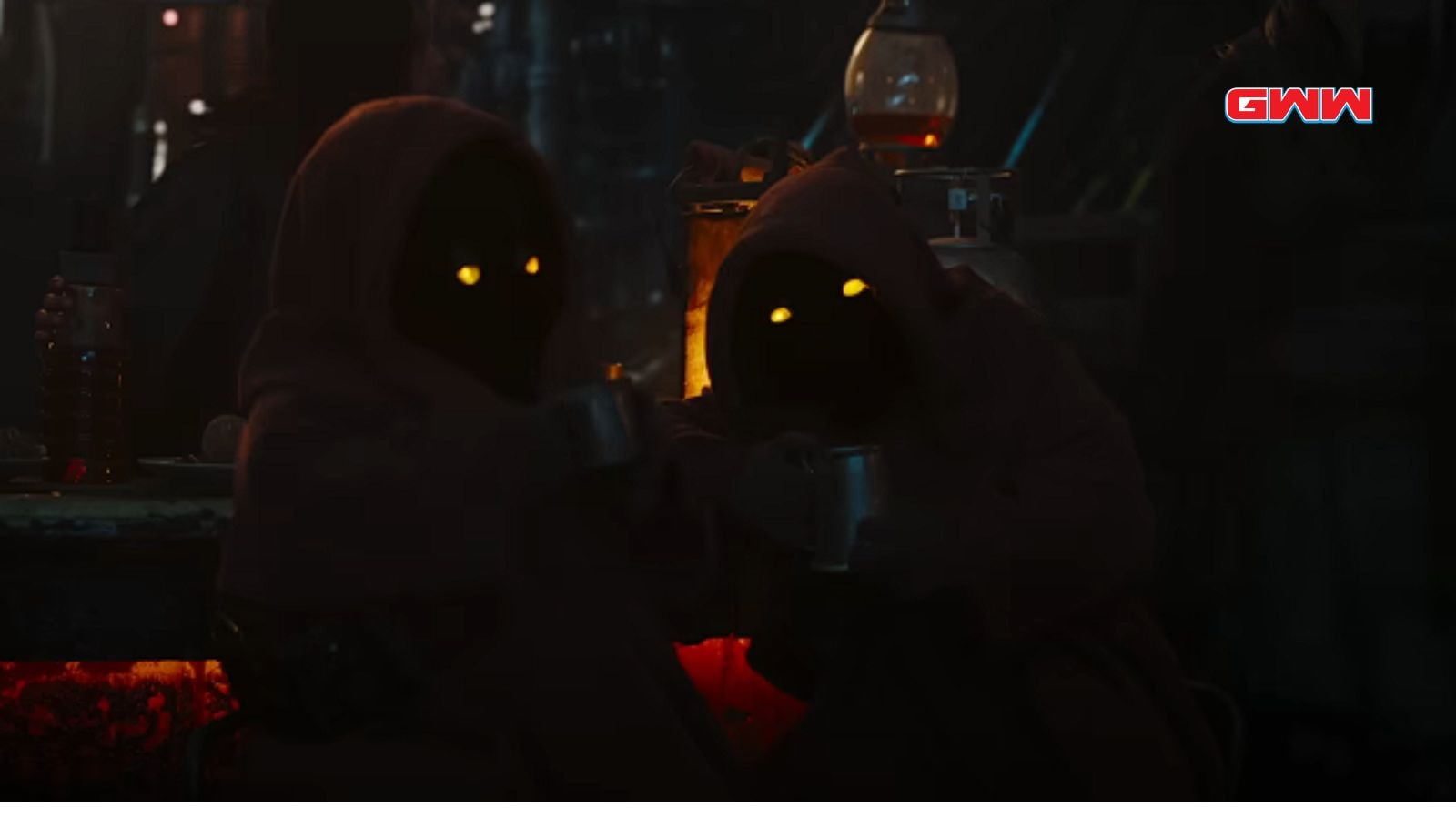 Two mysterious hooded figures with glowing eyes in a dark setting.