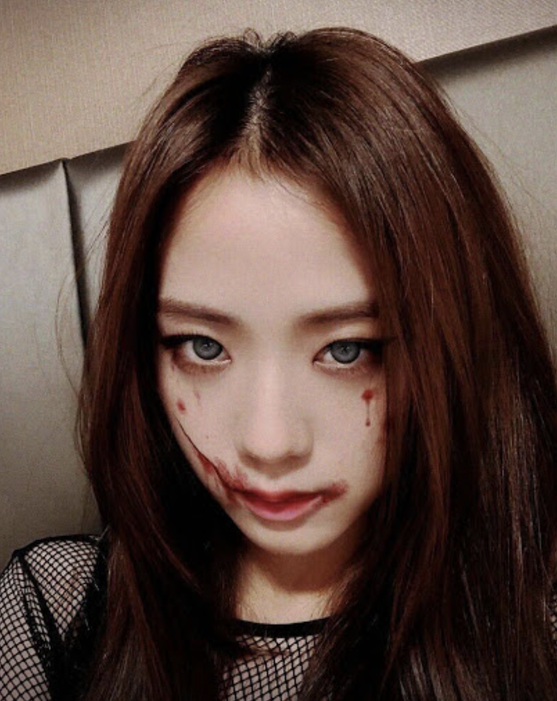 A picture of Jisoo with blood on her face 