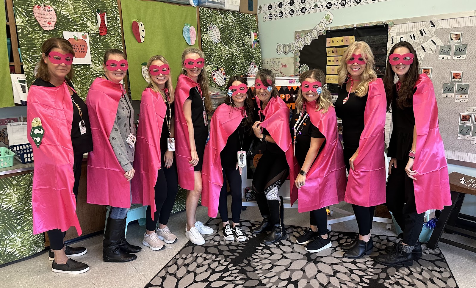 image of students and teacher in costume for Halloween