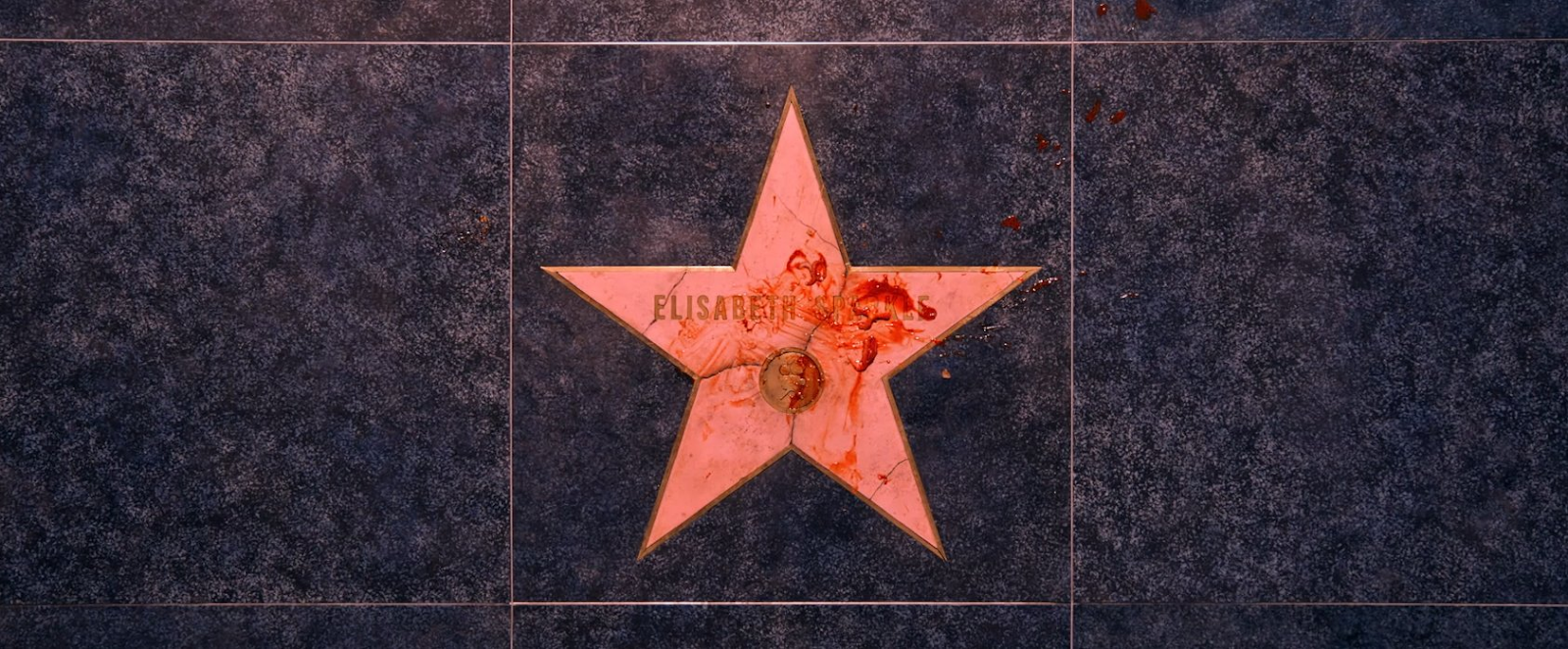 "The Substance" Analyzed: Man spilled food on the celebrity's star of fame. 