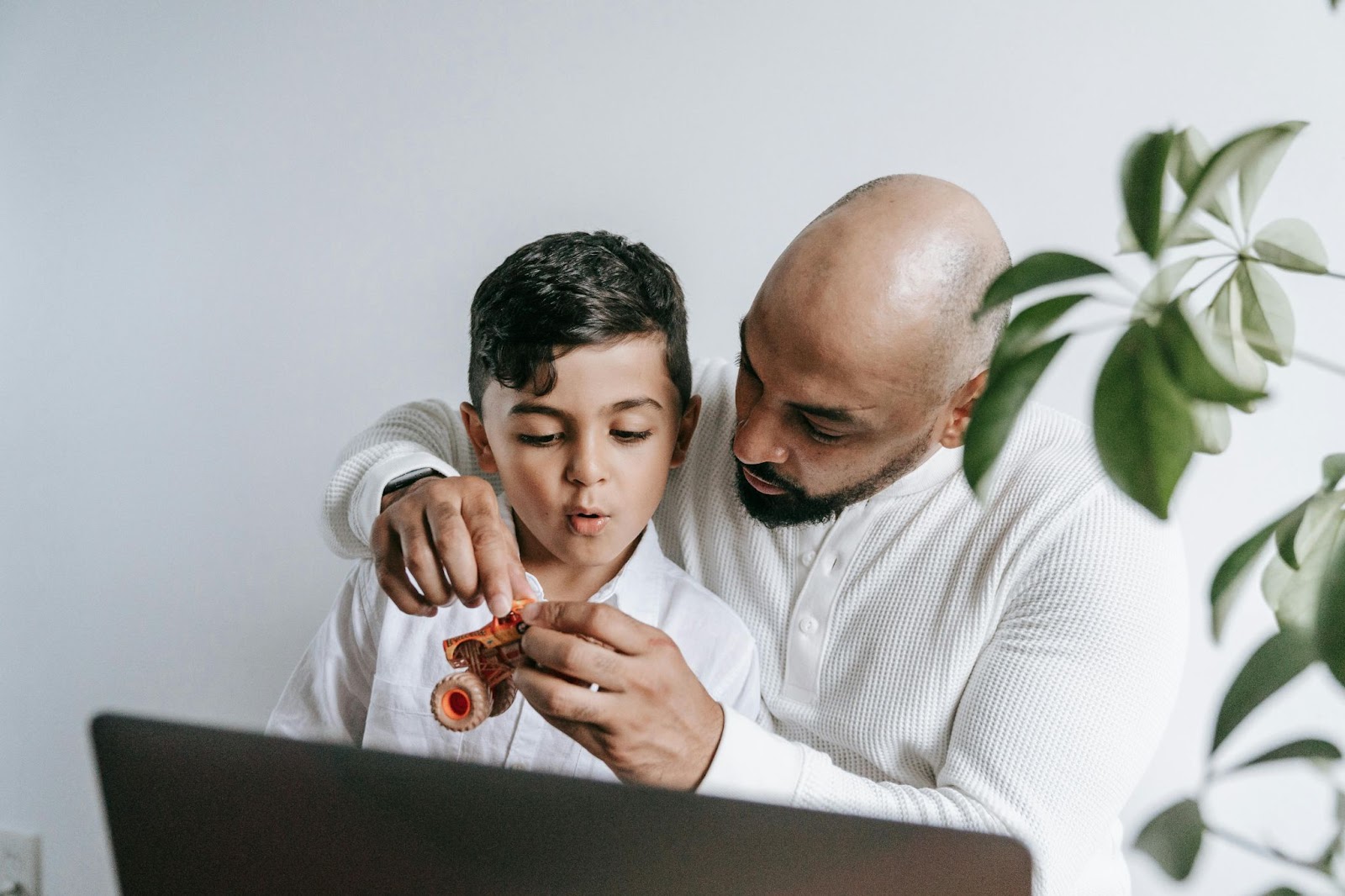 A father playing with his young son