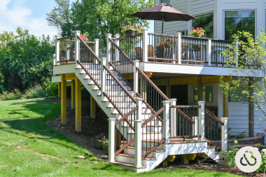 when to hire a michigan deck installer multi level decking space with composite railing on sloped yard custom built okemos
