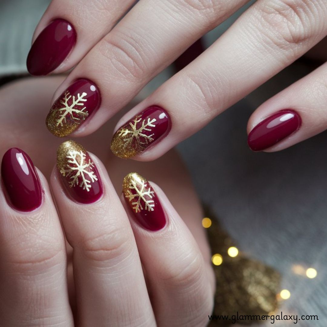 Snowflake Nails having Burgundy Nails with Gold Sparkles
