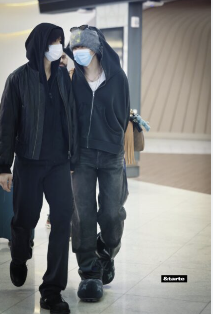 A picture of  Wonbin and Sohee wearing face masks.
