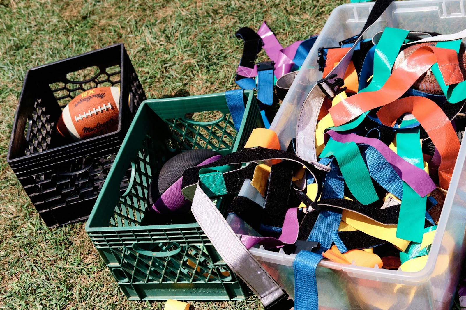 a box of flag football accessories used at outdoor corporate retreats to help teams bond.