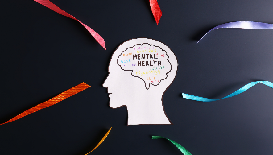 A paper cut out of a head with a brain and colorful ribbons around it

AI-generated content may be incorrect.