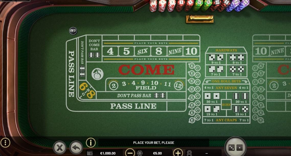 A green table with cards and chips

Description automatically generated