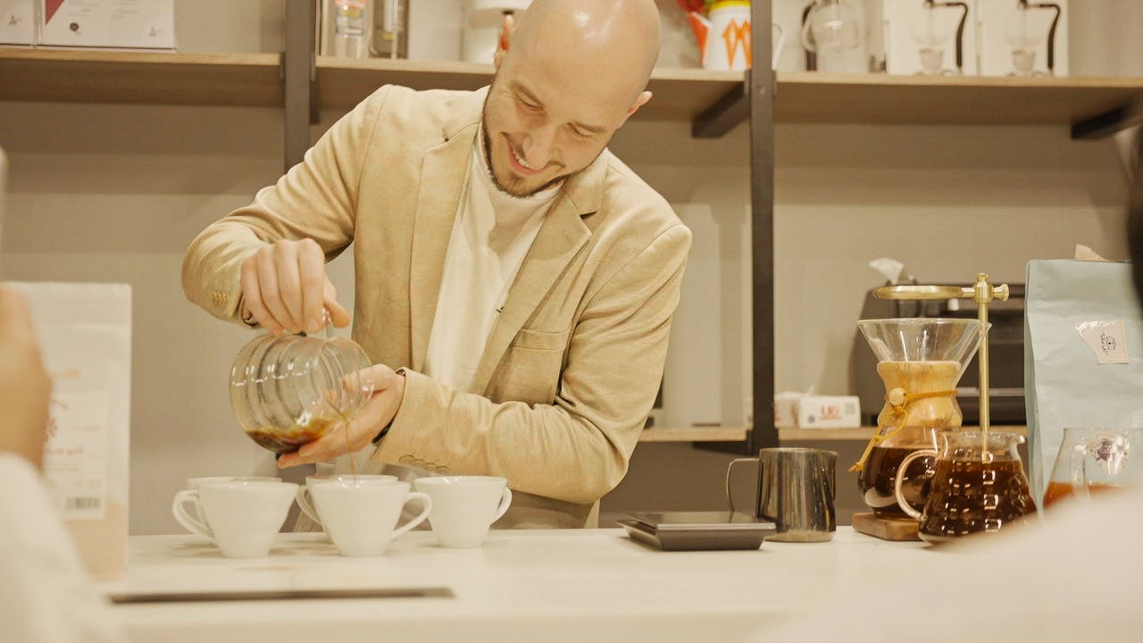 Baristas showcasing their skills during the coffee event.