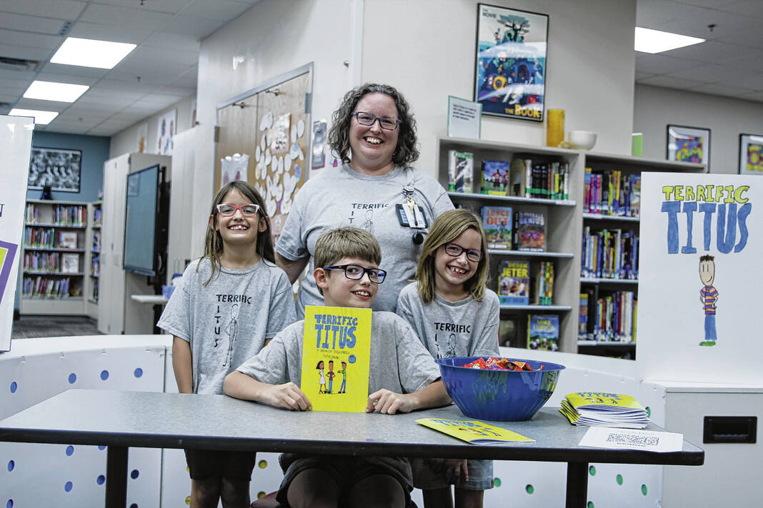 Student Author Titus Ehlen with friends and teacher