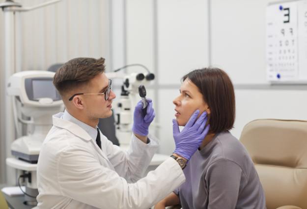 Doctor checking her patient Eyes