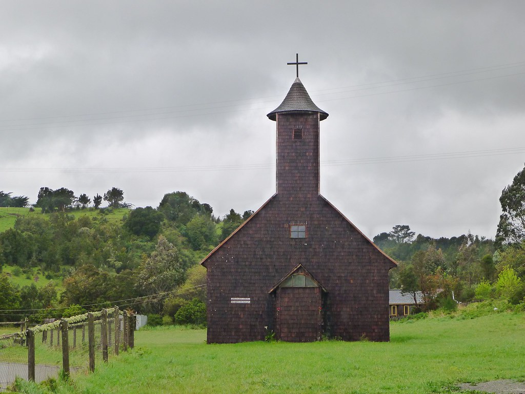 A church surrounded by greenery.