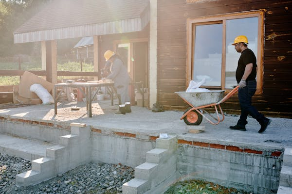 A Man Pushing a Wheelbarrow 