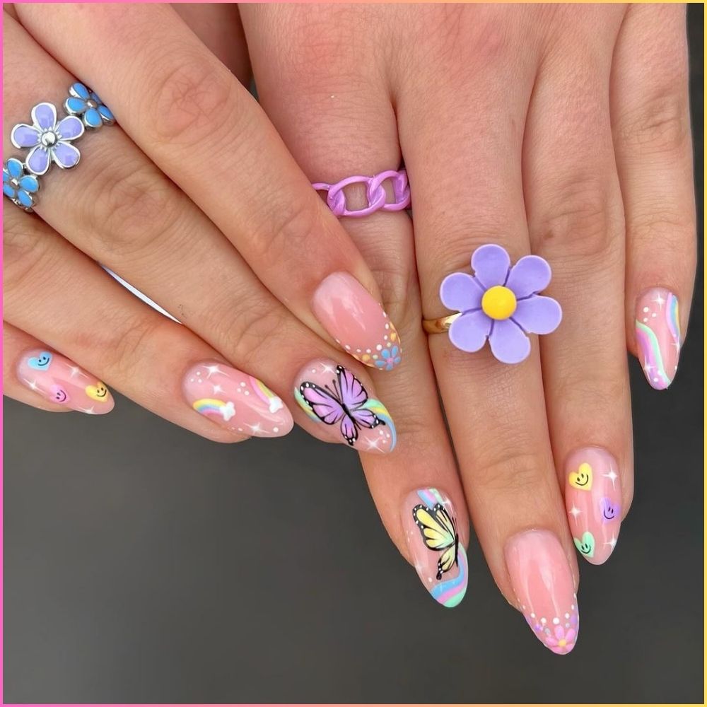 Close up of hands with flowered designed blue nails having Cute Pastels