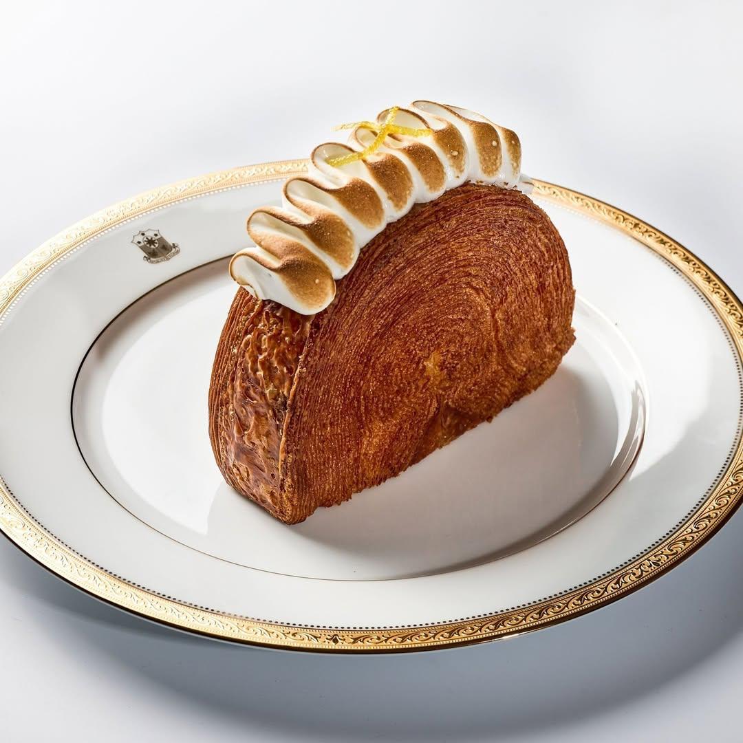 A piece of pastry on a plateDescription automatically generated