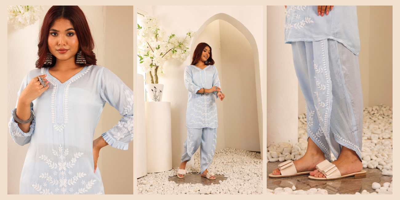 A woman wearing a pastel blue kurta set with white chikankari embroidery on it