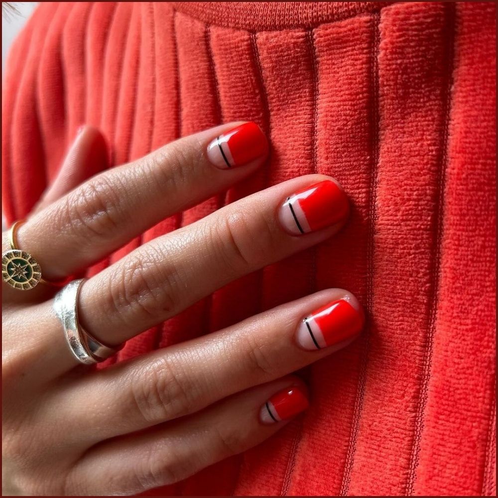 Close up of hands having Christmas red nails with Minimalist Red Christmas Nails