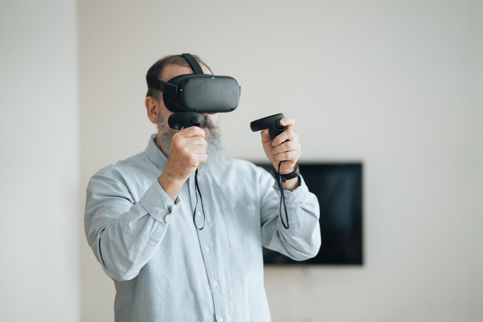Man use VR headset to play games at home