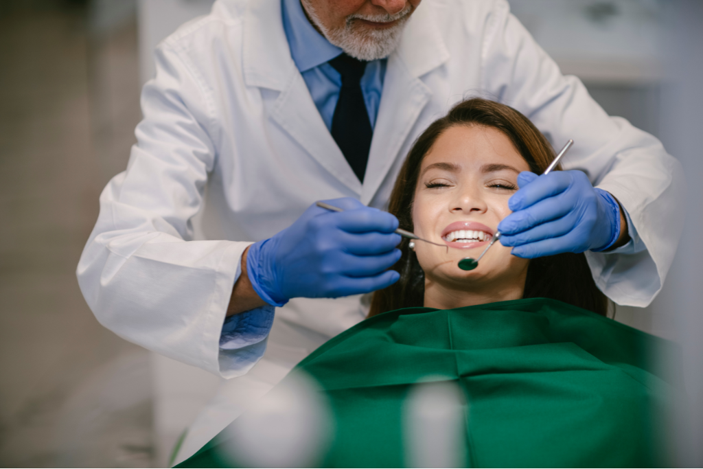 dentist-performing-a-dental-checkup-on-a-patient-during-an-invisalign-consultation