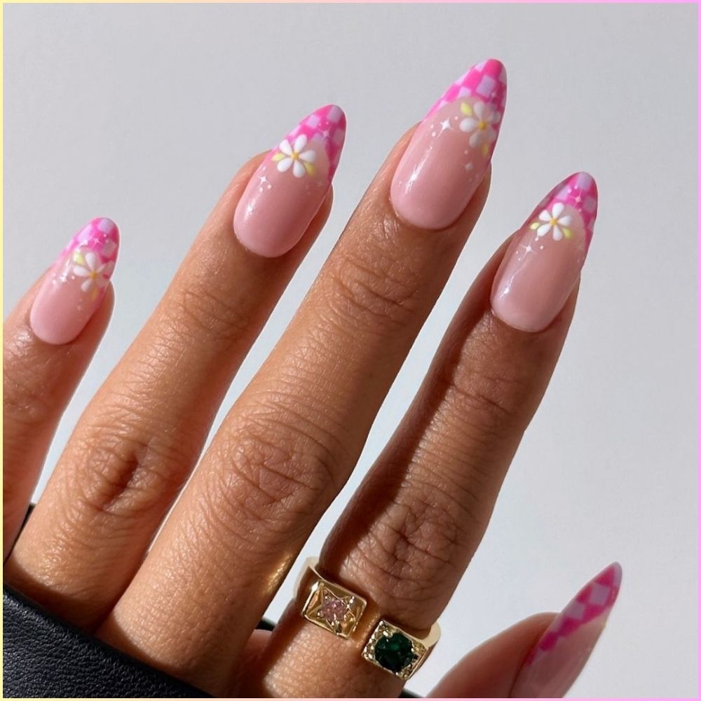 Zoom in view of hand with simple French tip nail having Playful pink tips