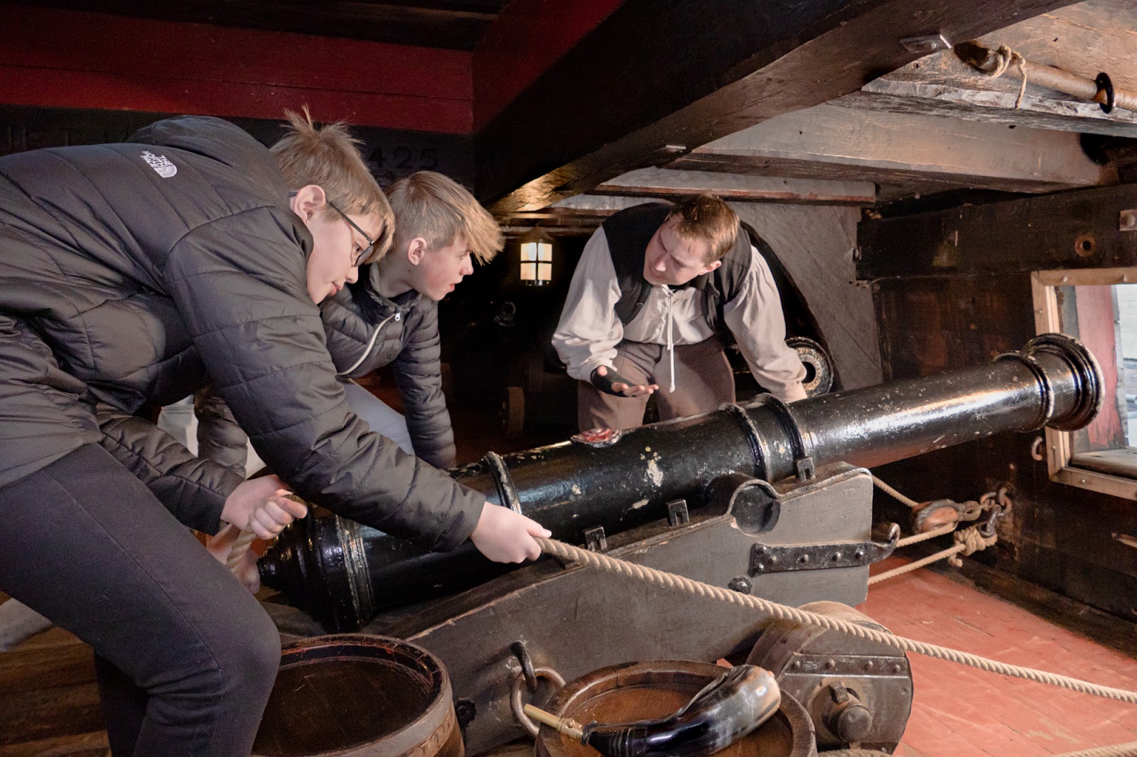 Crew demonstrating cannon drill on The Golden Hinde