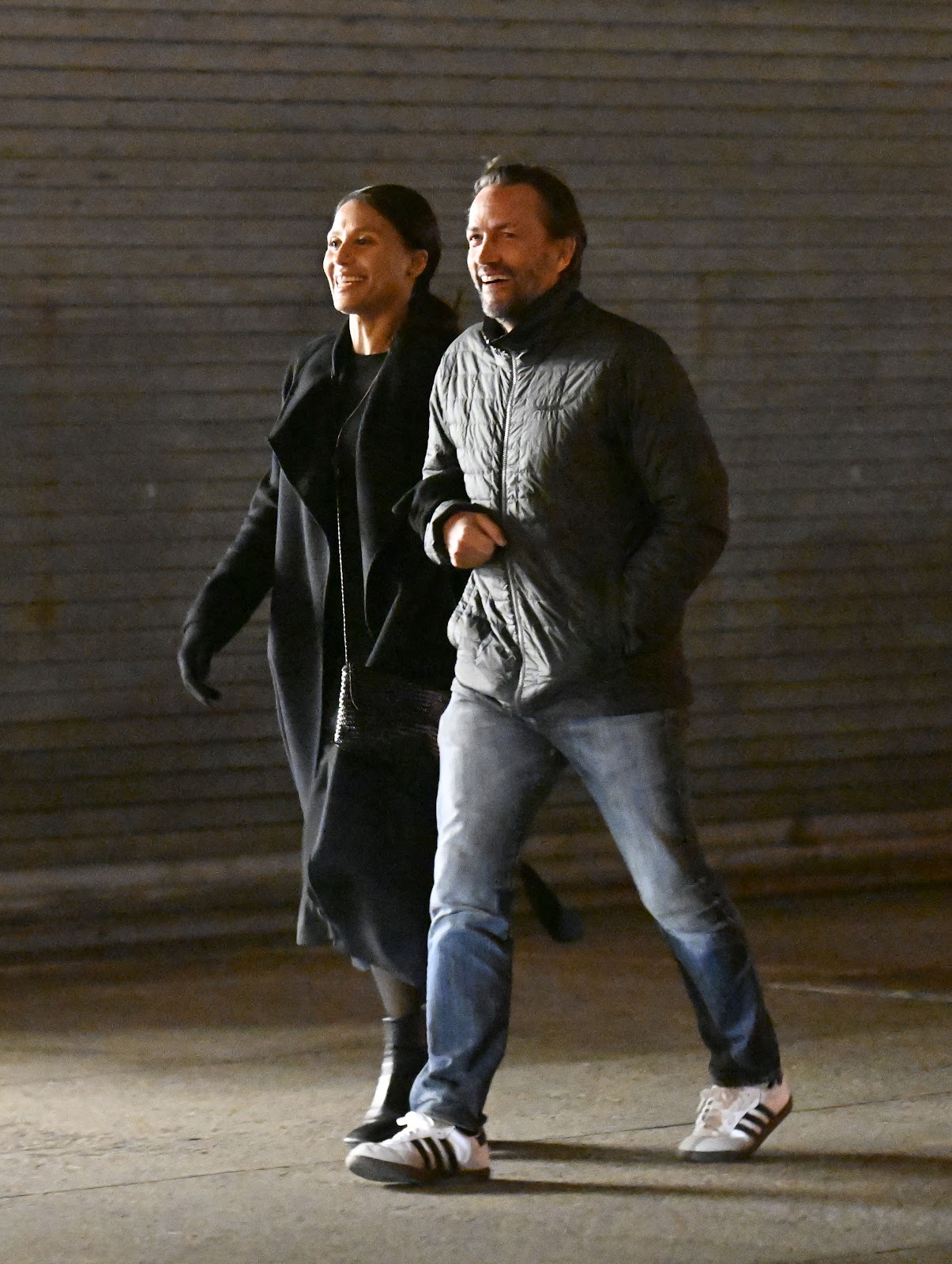 Marilee Fiebig and Andrew Shue are seen walking home after having dinner at "The Fulton" on March 1, 2024 | Source: Getty Images