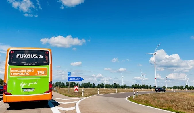 A FlixBus bus on a highway in Europe during the summer