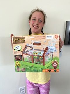 Ava holding a prize