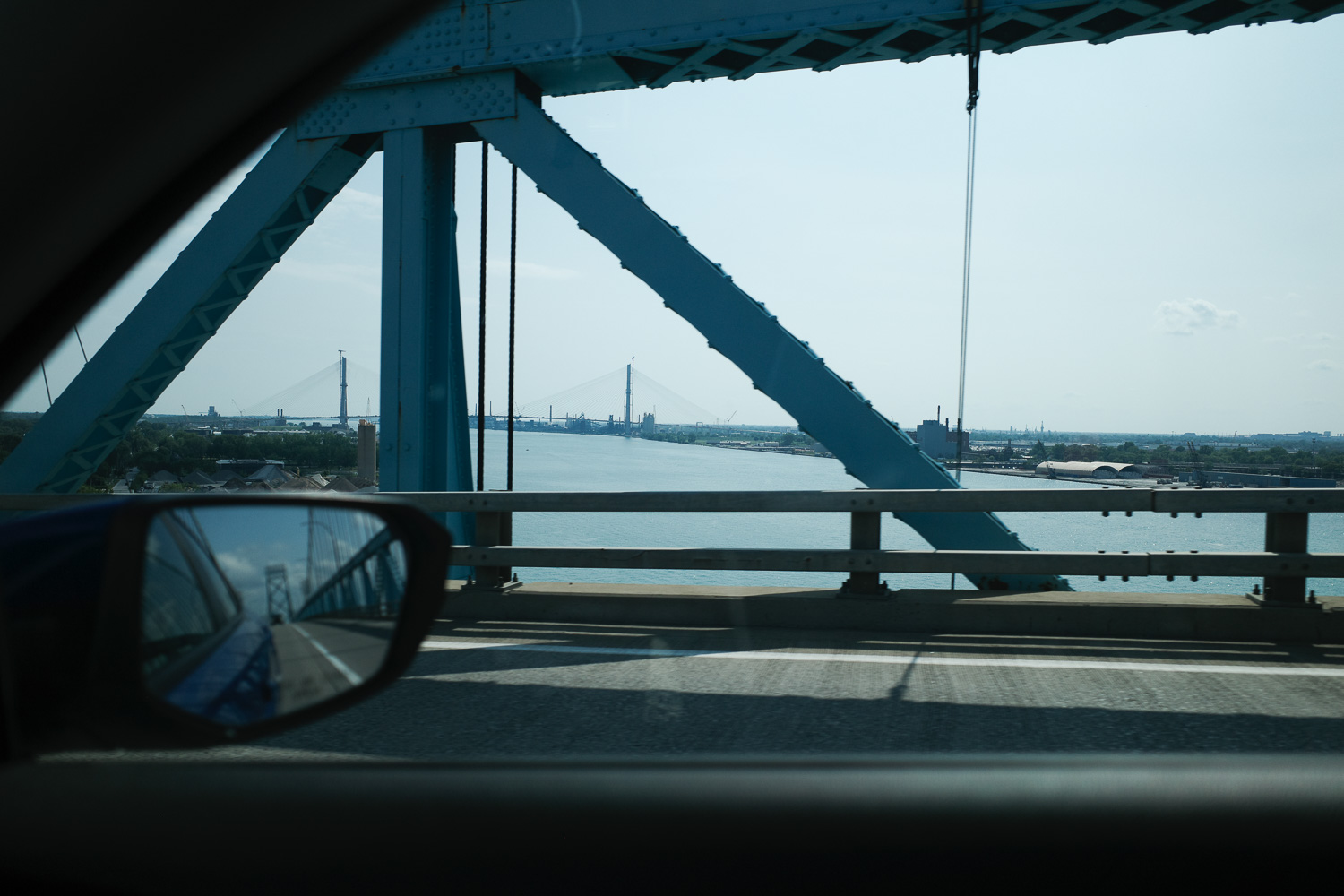 View of the Gordie How bridge from inside a car on the Ambassador bridge.