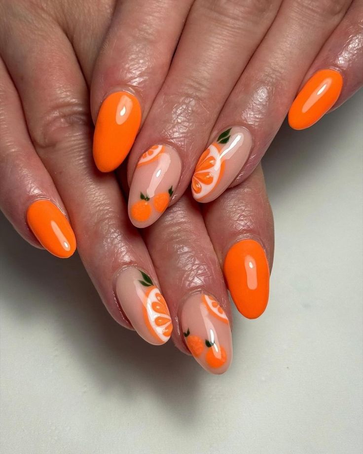 Close up of nails with glittery orange nails having Summer Citrus Nails