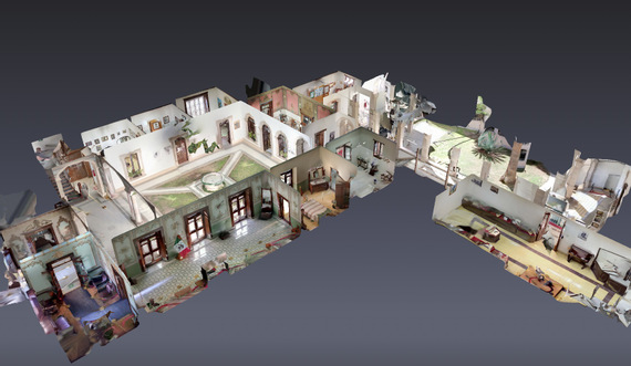 Real estate agent using 3D scanning camera to capture property layout