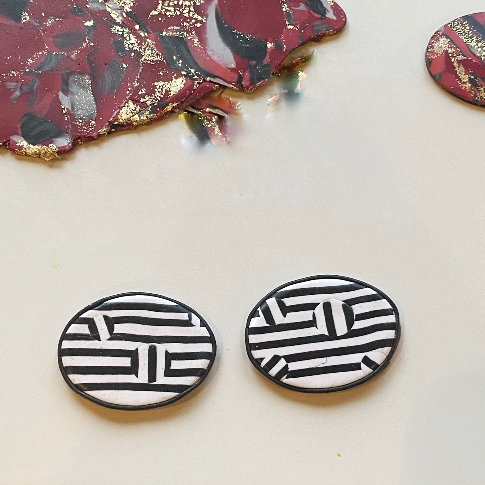 Polymer clay thin black edging line on black and white earrings