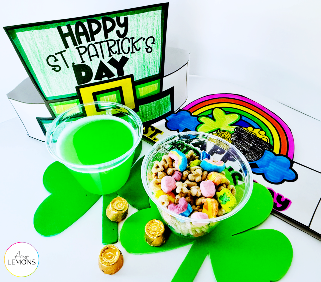 St. Patrick's Day hat and rainbow craft with a cup of green juice and a cup of lucky charms cereal.