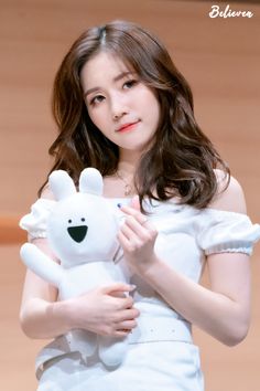 This  contain an image of Lovelyz Jin holding a white teddy bear in her hands