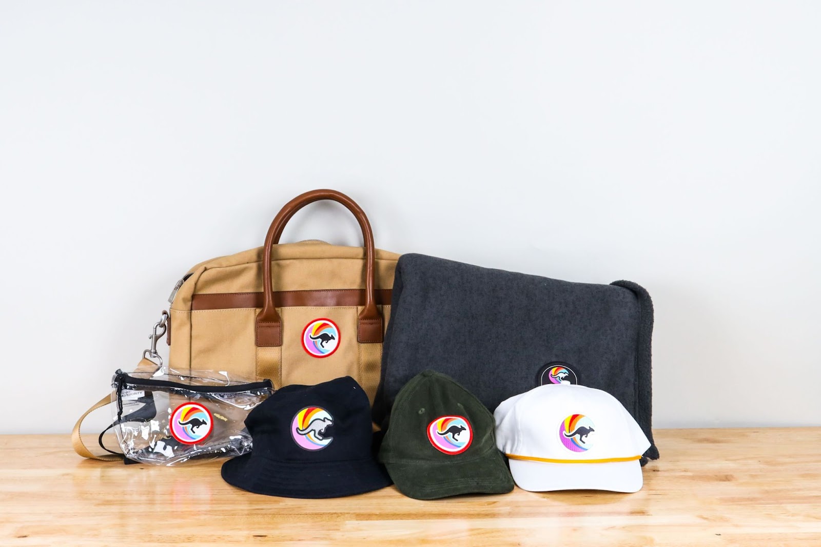 wide view of bags and assorted caps customized with a peel and stick patch