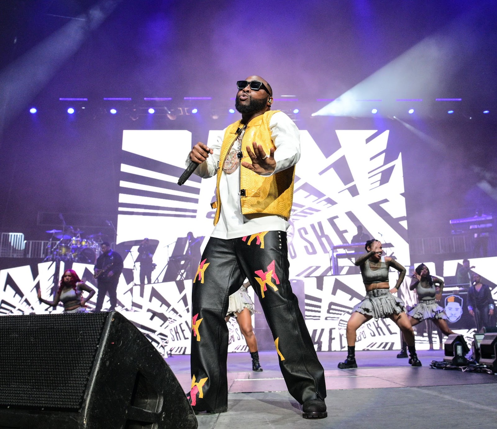 Davido performing live on stage at the 2025 UK concert at Tottenham Hotspur Stadium.