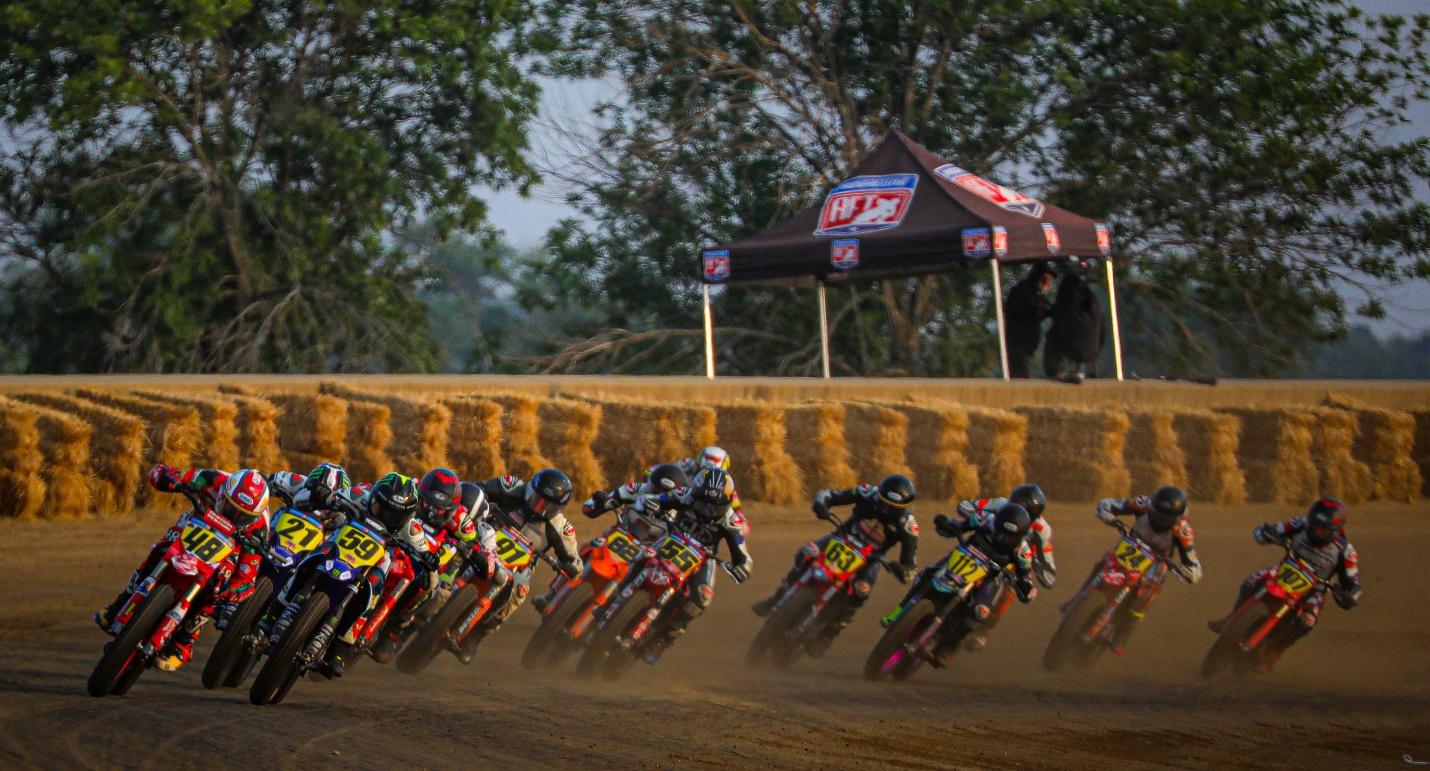 A group of people on motorcycles racing

AI-generated content may be incorrect.