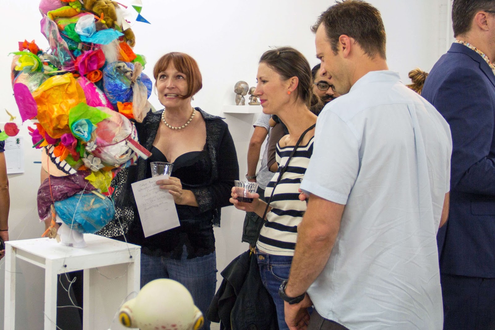 People looking at art at RULE Gallery in Denver