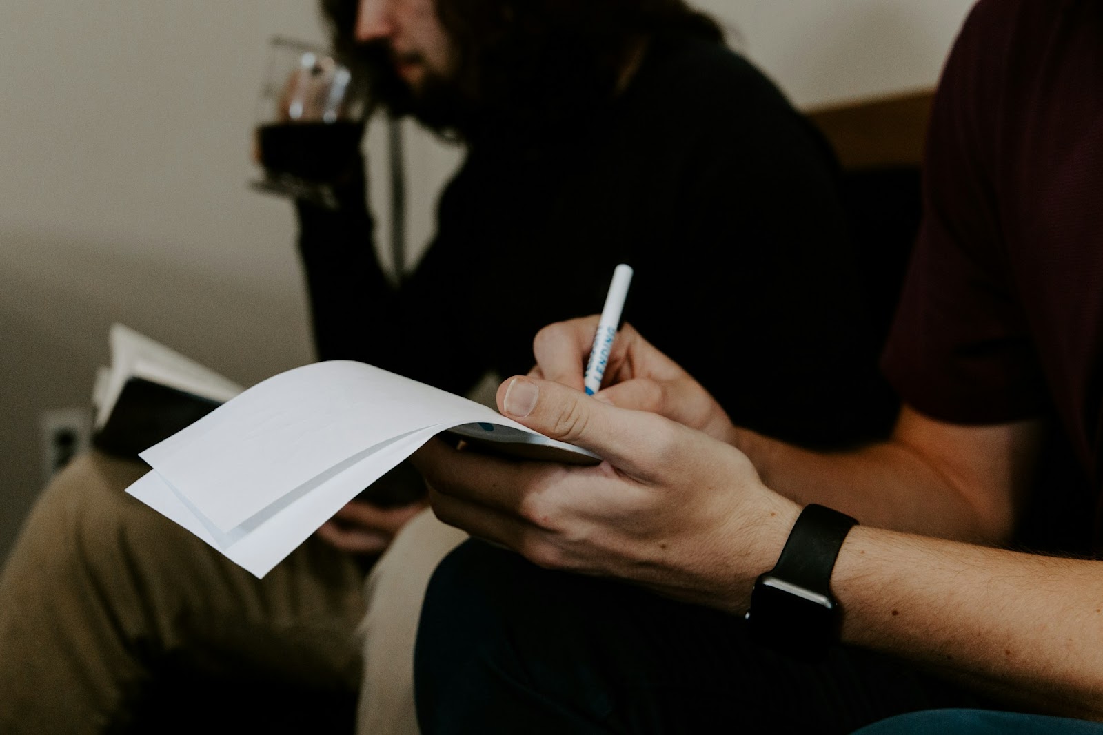 Man filling out documents.