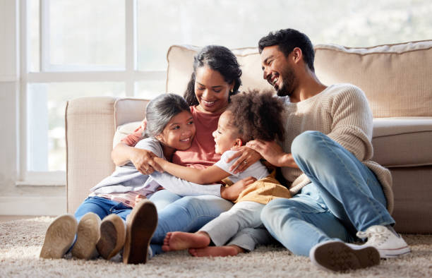 Candid photoshoot idea with a family sharing joyful moments indoors