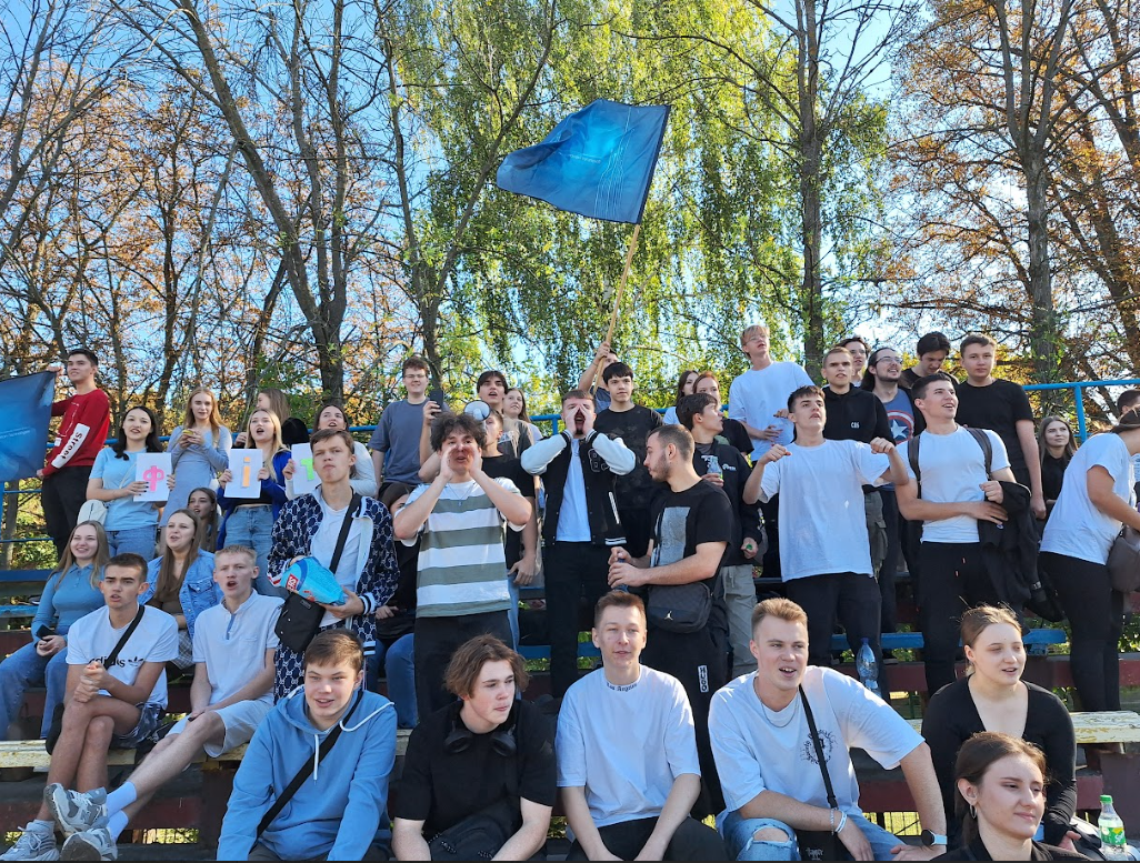 A group of people sitting on bleachers