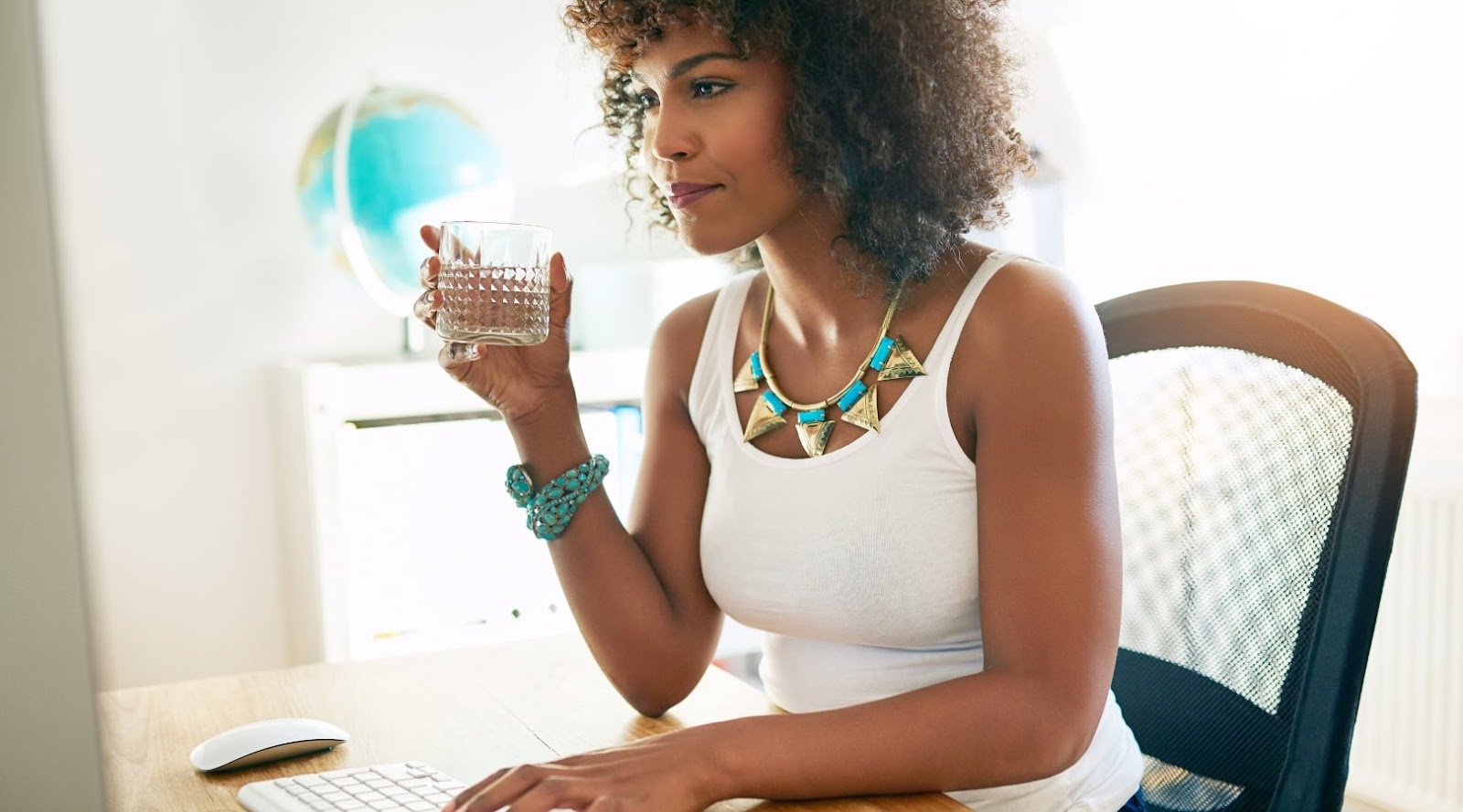 Business woman in Toronto drinking water.