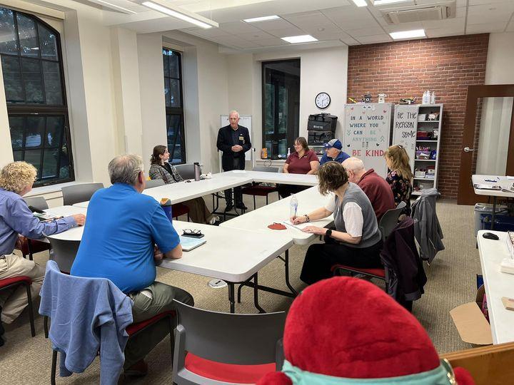 May be an image of 6 people, people studying and table