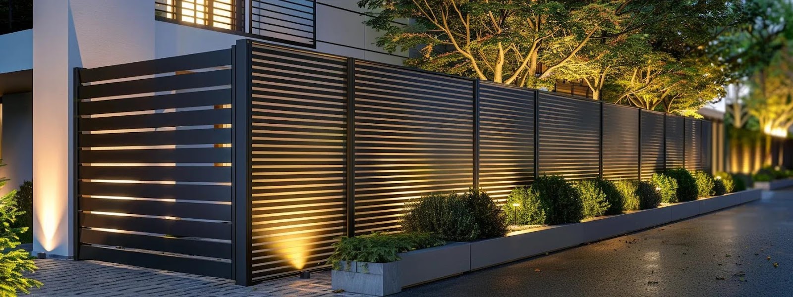 Modern residential fence with horizontal slats, integrated lighting, and surrounding greenery, emphasizing security and aesthetic appeal.