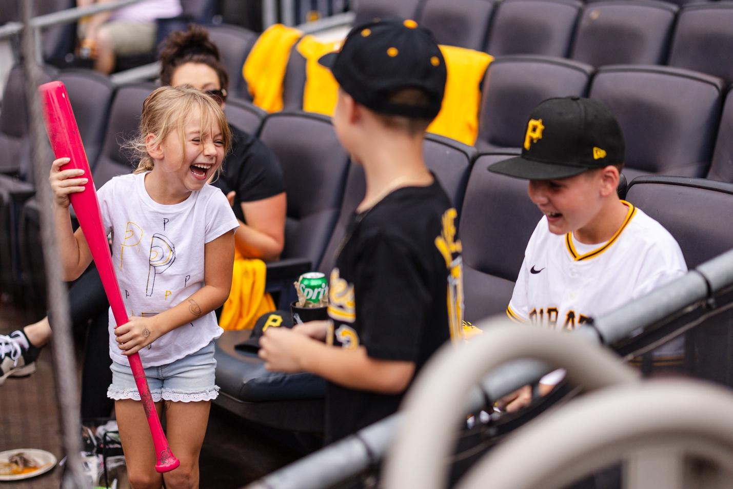 A group of kids in a stadiumAI-generated content may be incorrect.